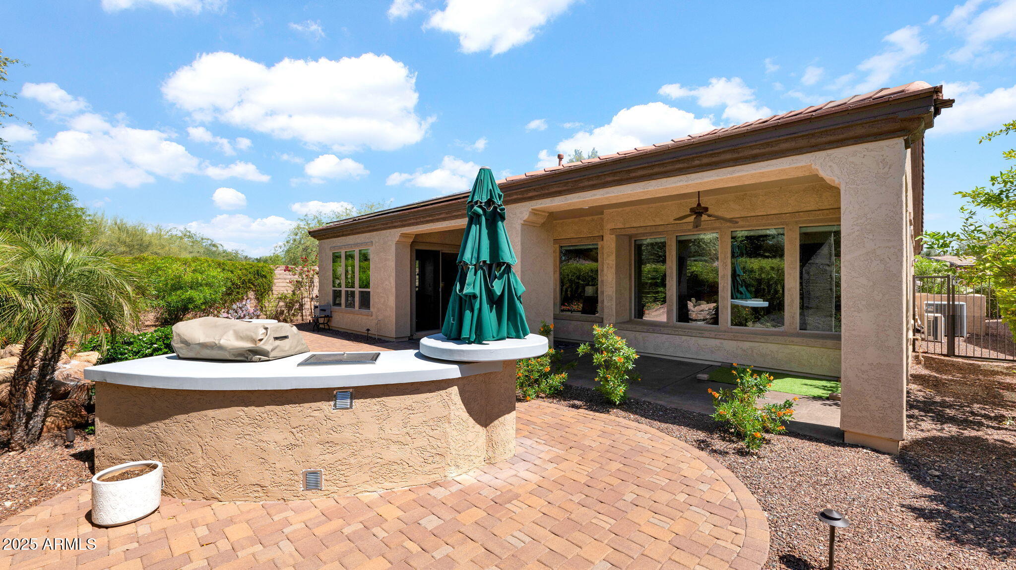12981 West Yellow Bird Lane Peoria, AZ 85383 - Photo 47 of 47 a view of a house with backyard porch and sitting area