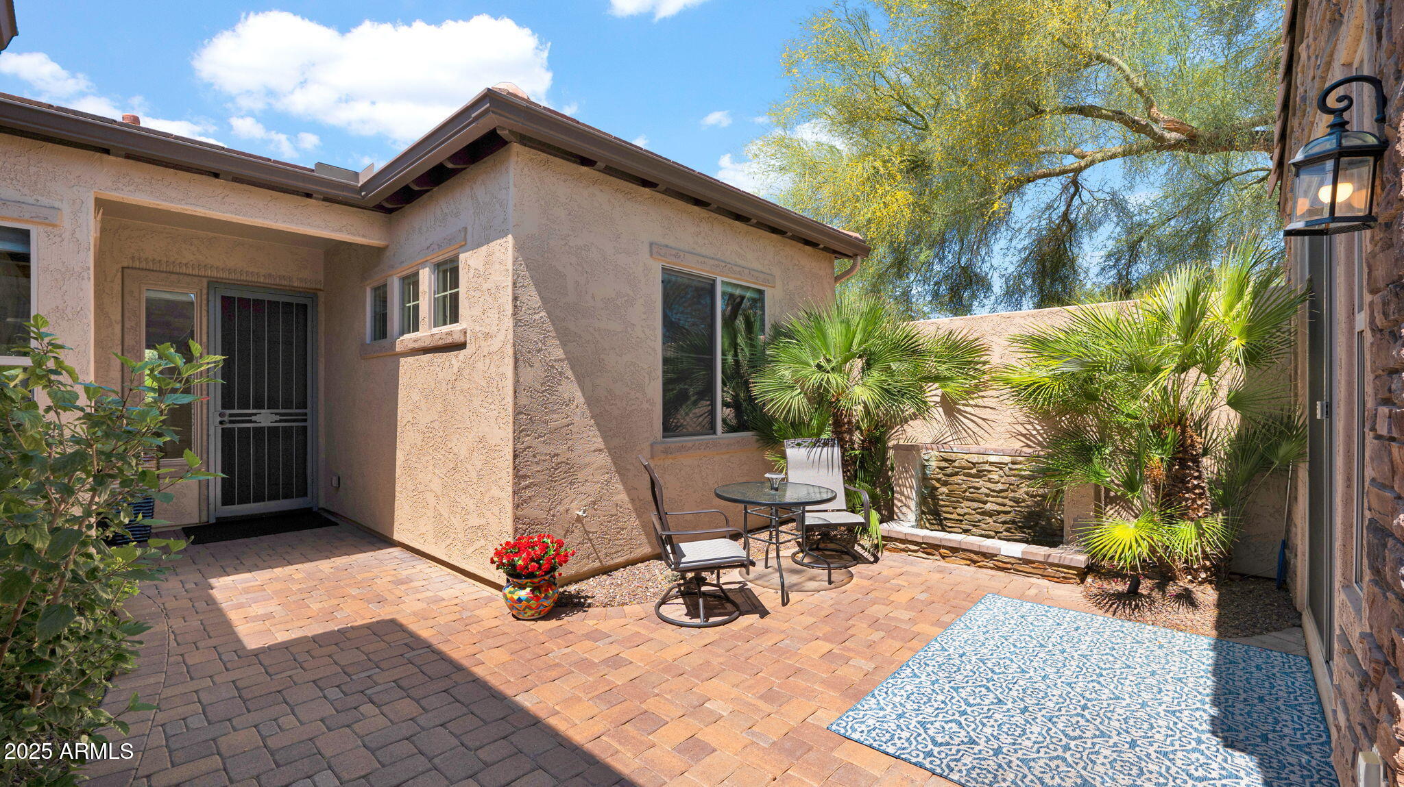 12981 West Yellow Bird Lane Peoria, AZ 85383 - Photo 5 of 47 a view of a house with backyard and sitting area