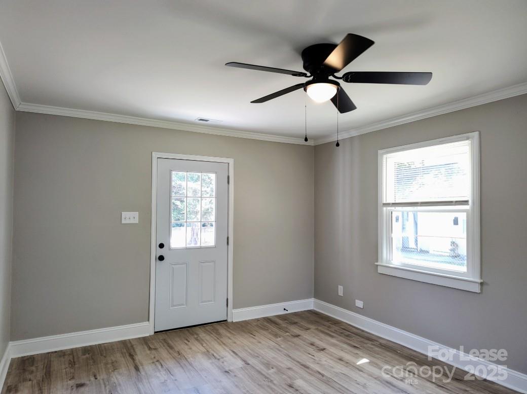 1239 Bose Avenue Rock Hill, SC 29732 - Photo 2 of 18 a view of an empty room with wooden floor and a window