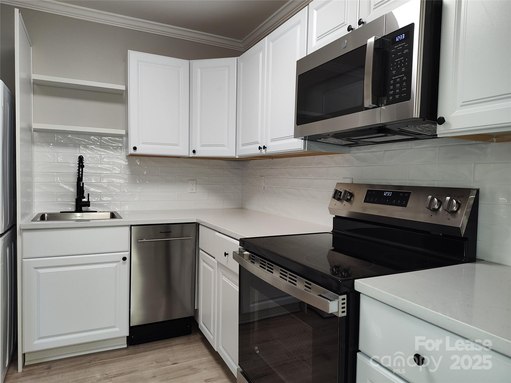 1239 Bose Avenue Rock Hill, SC 29732 - Photo 5 of 18 a kitchen with cabinets appliances and a sink