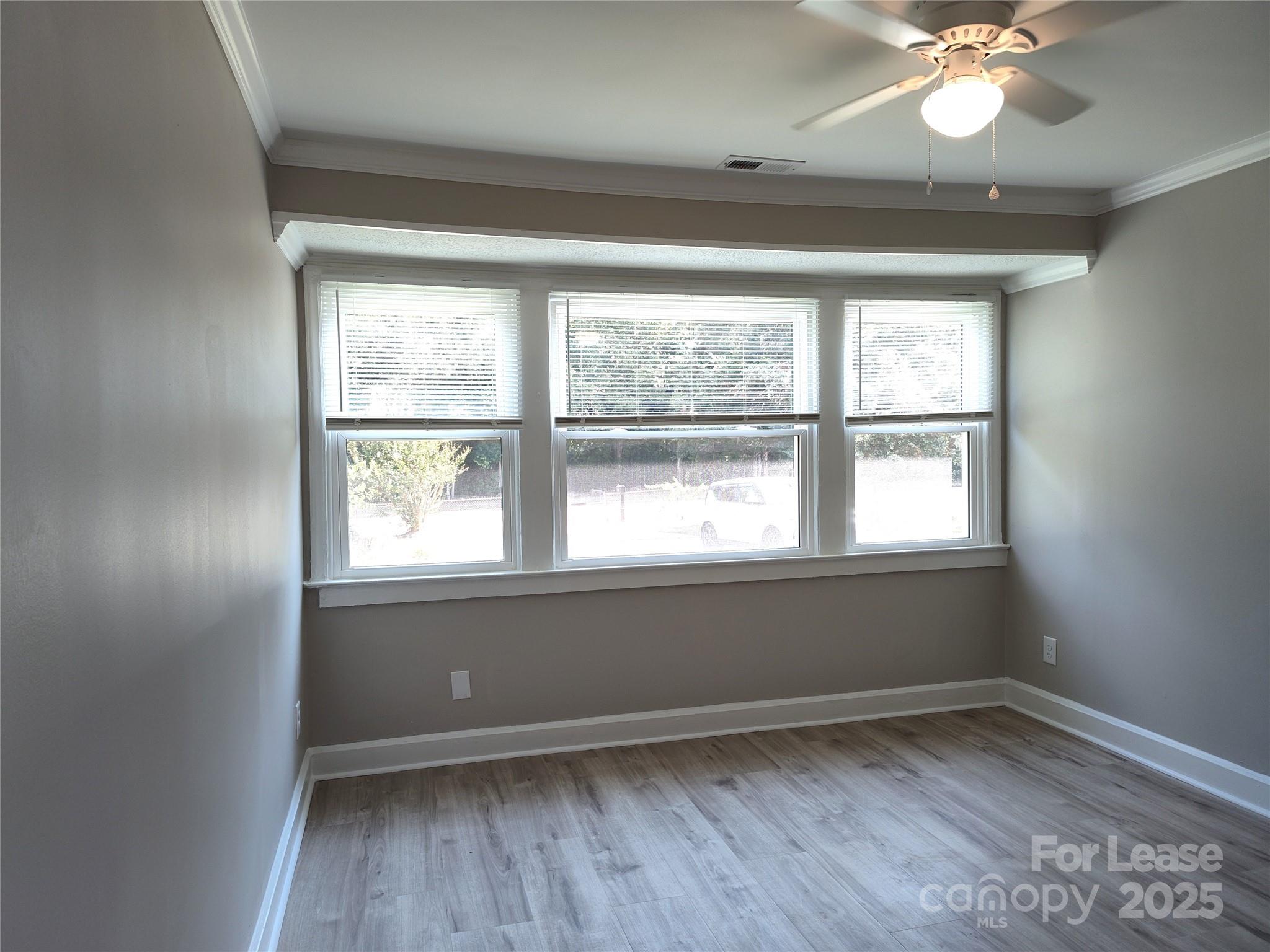 1239 Bose Avenue Rock Hill, SC 29732 - Photo 8 of 18 an empty room with wooden floor and windows
