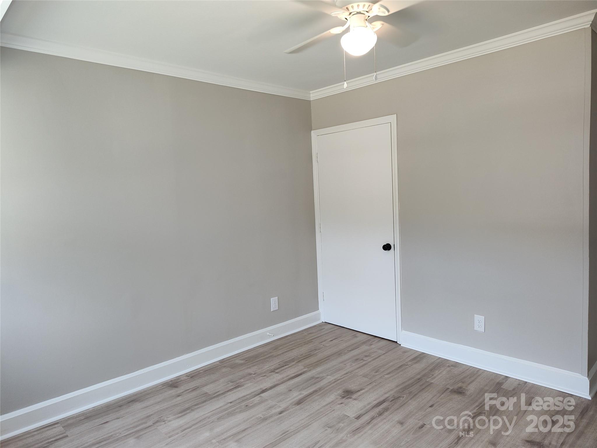1239 Bose Avenue Rock Hill, SC 29732 - Photo 9 of 18 a view of an empty room with wooden floor