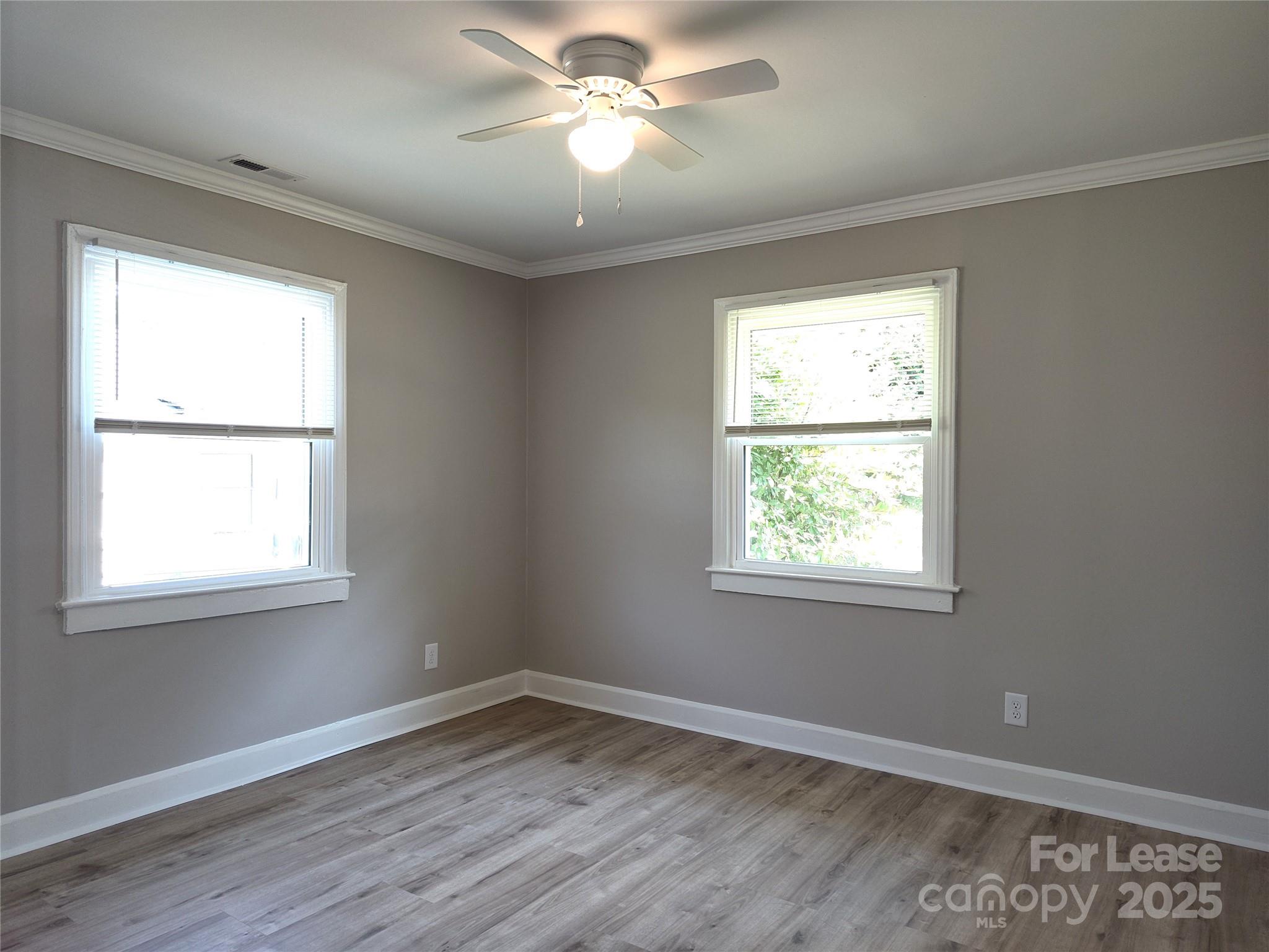 1239 Bose Avenue Rock Hill, SC 29732 - Photo 10 of 18 a view of an empty room with wooden floor and a window