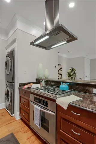 a stove top oven sitting inside of a kitchen