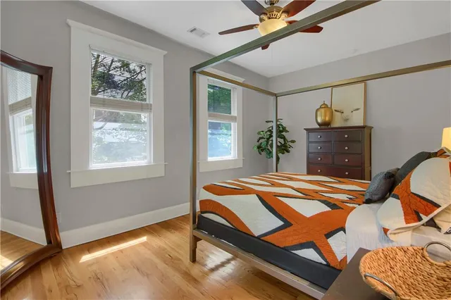 a bedroom with a bed and a window