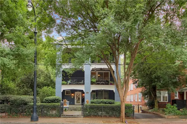 a view of a large building with large tree