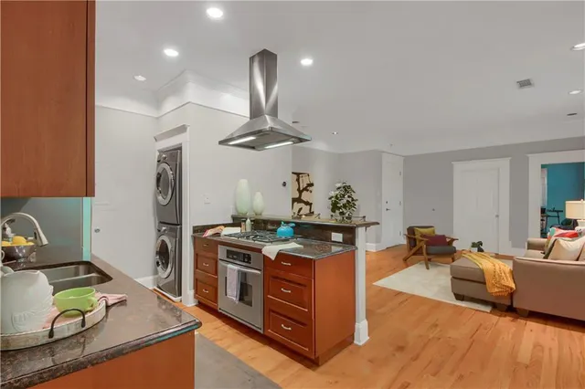 a kitchen with stainless steel appliances granite countertop a stove and a sink