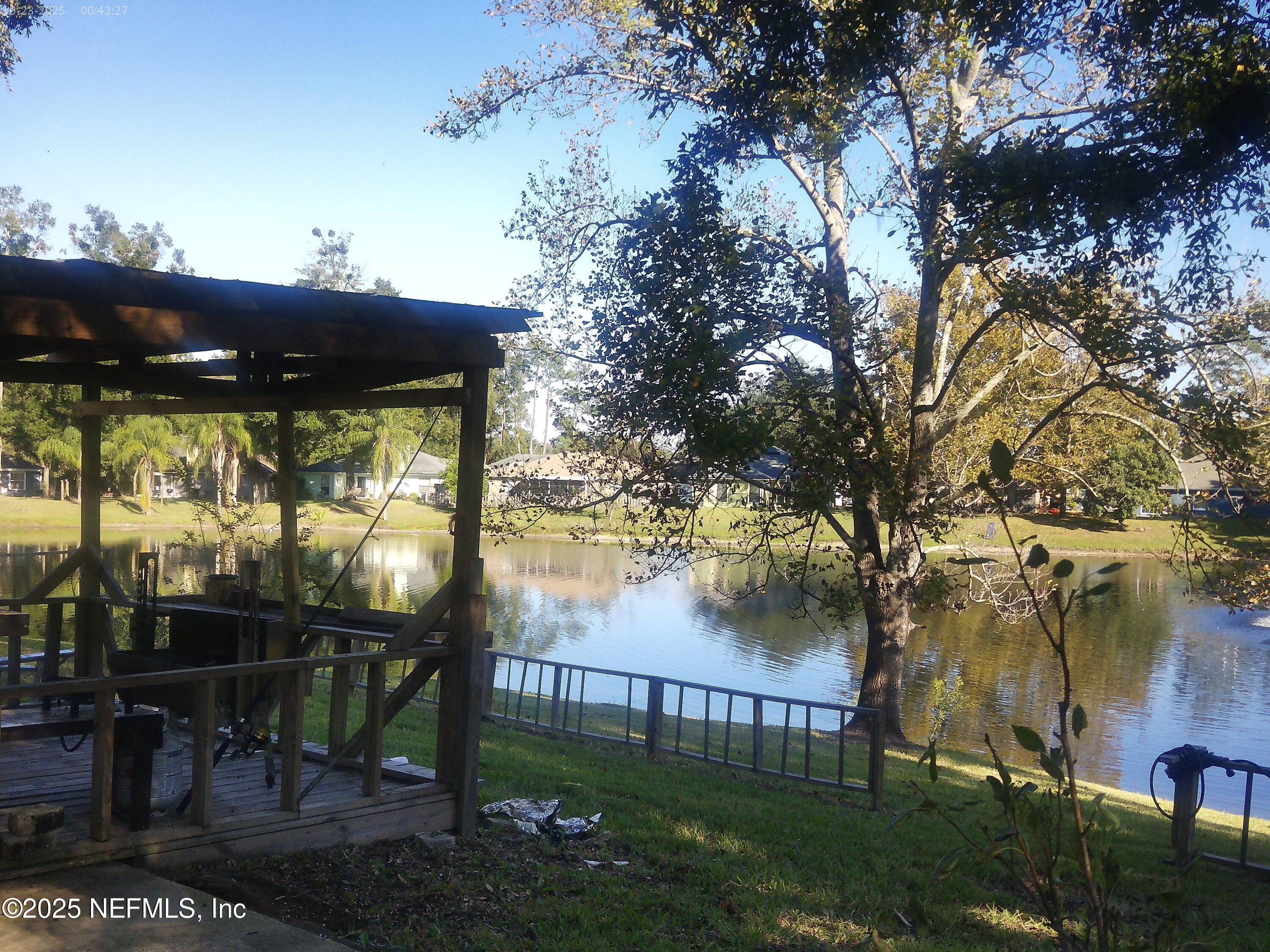 1641 Spring Oaks Lane Jacksonville, FL 32221 - Photo 11 of 24 a view of a porch with furniture and a yard