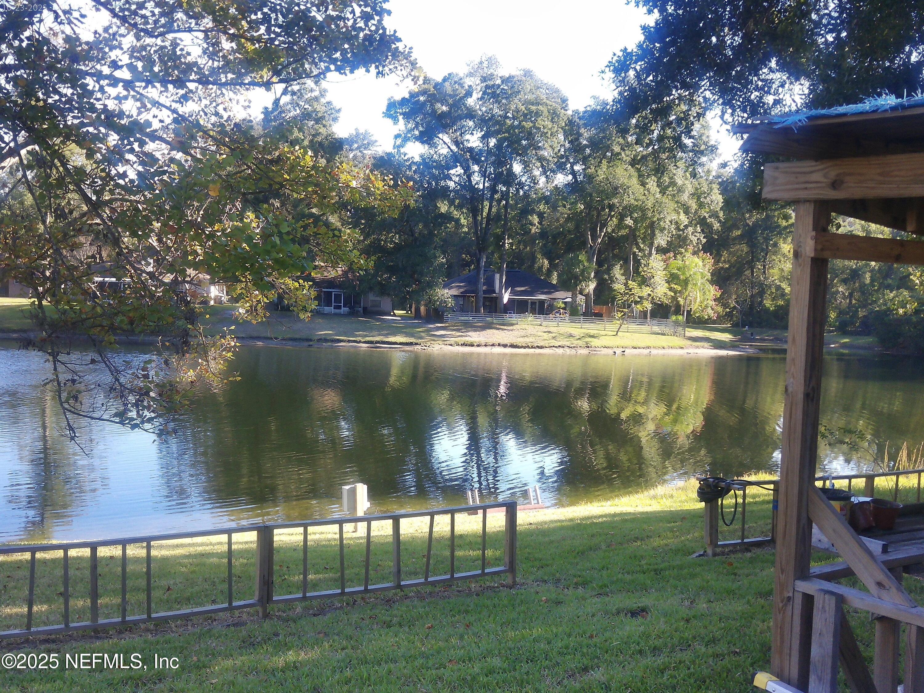 1641 Spring Oaks Lane Jacksonville, FL 32221 - Photo 14 of 24 a view of a lake from a yard