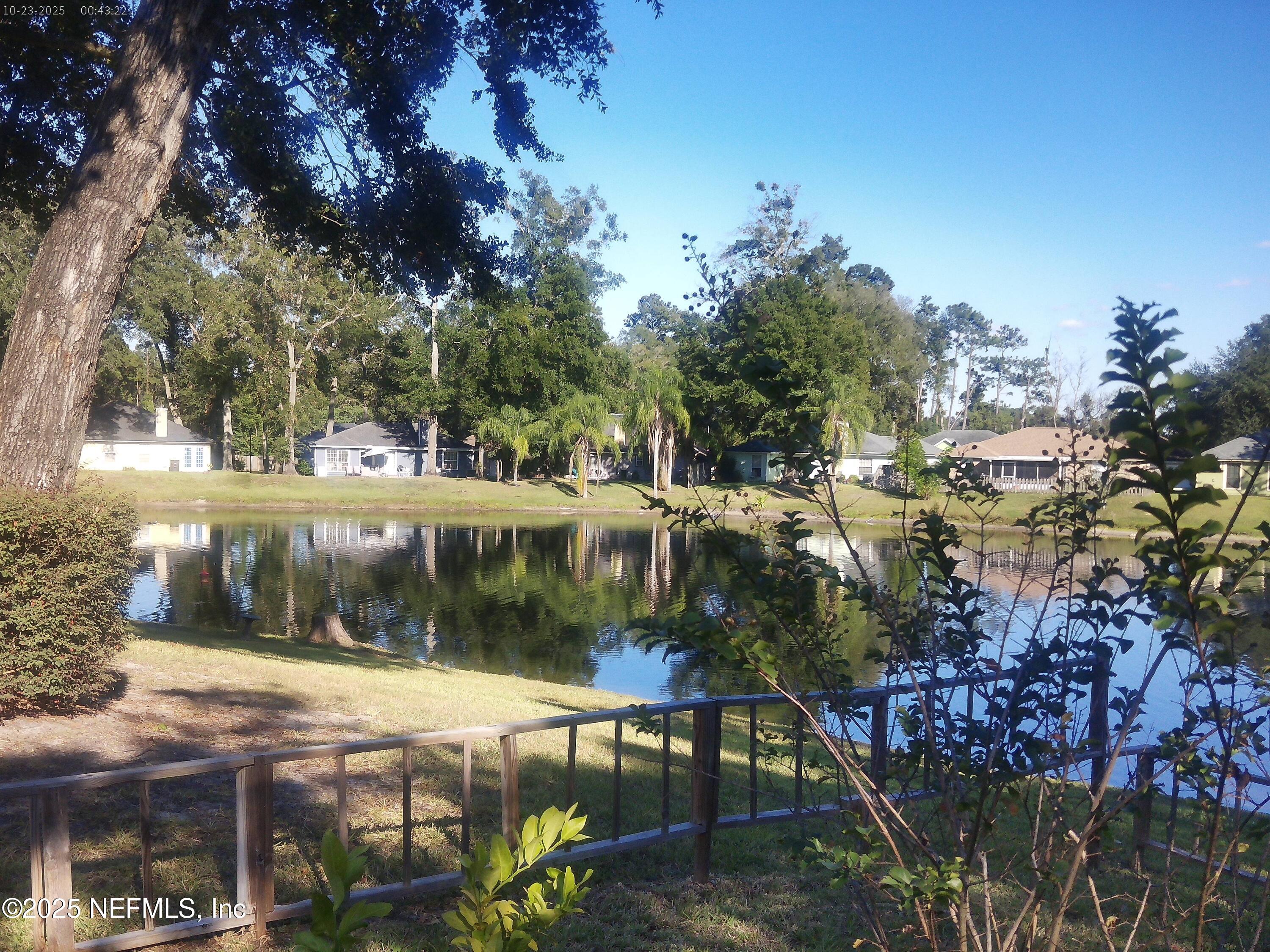 1641 Spring Oaks Lane Jacksonville, FL 32221 - Photo 15 of 24 a view of a lake with a house