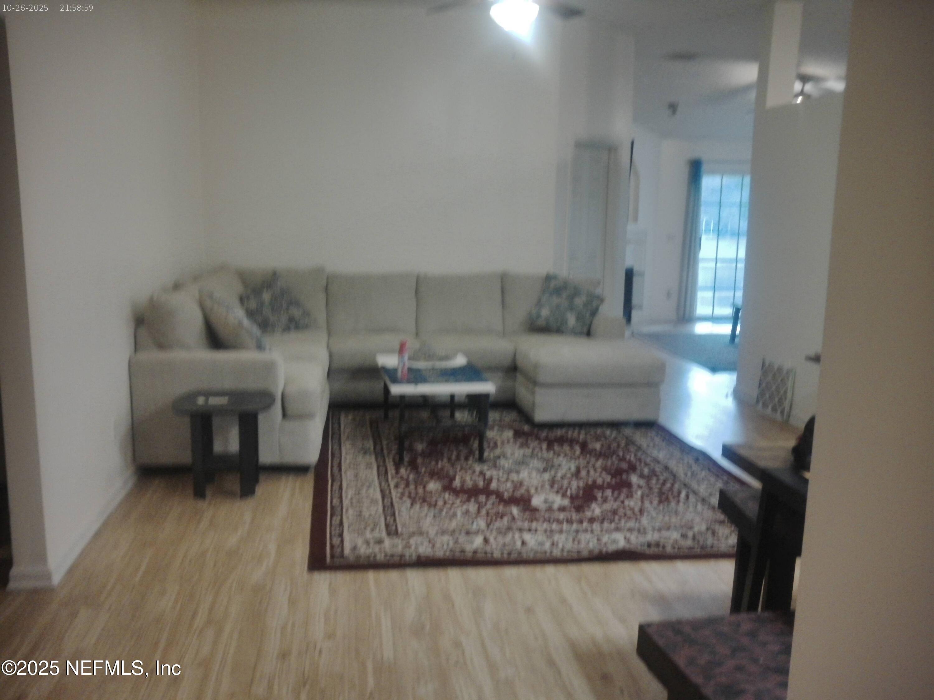 1641 Spring Oaks Lane Jacksonville, FL 32221 - Photo 16 of 24 a living room with furniture and a wooden floor