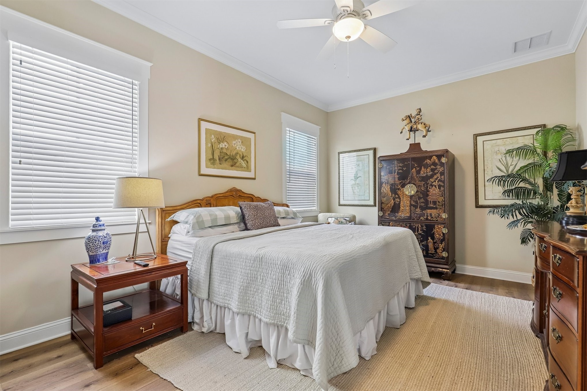 1012 White Street Fernandina Beach, FL 32034 - Photo 20 of 35 a bedroom with a bed and a chandelier