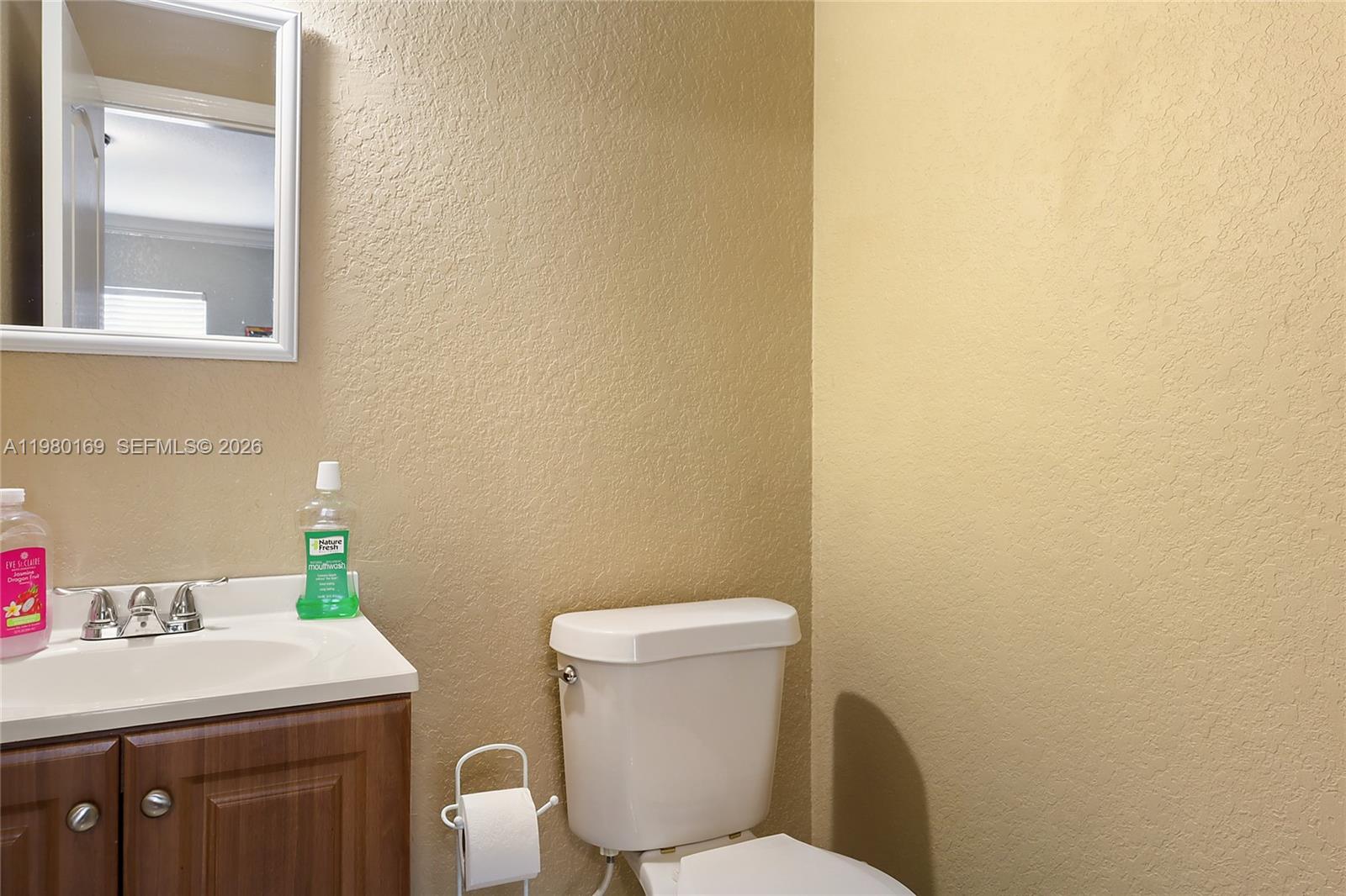11397 Southwest 185th Terrace Miami, FL 33157 - Photo 11 of 15 a white toilet sitting next to a bathroom sink