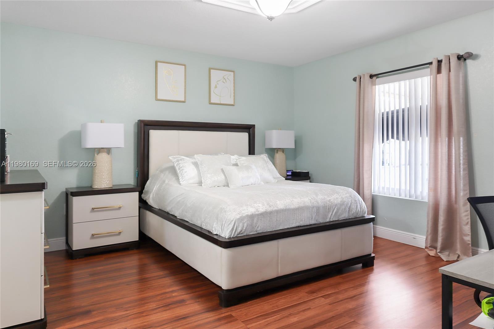 11397 Southwest 185th Terrace Miami, FL 33157 - Photo 12 of 15 a large bed sitting in a bedroom next to a window