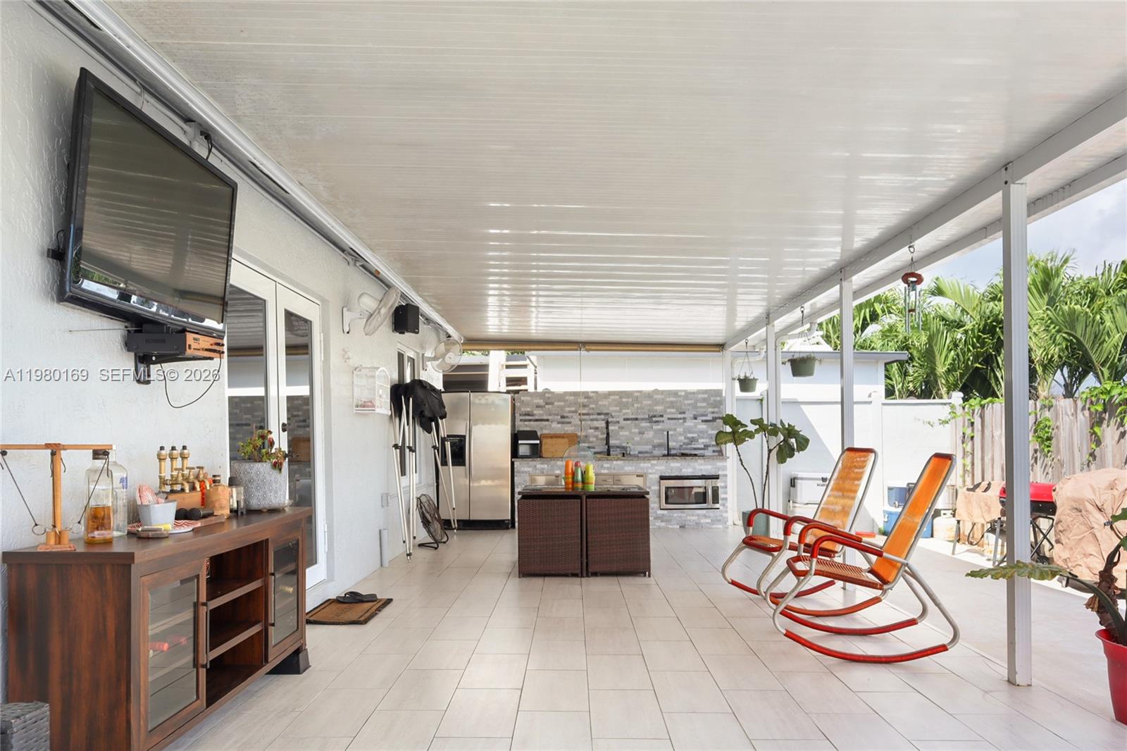 11397 Southwest 185th Terrace Miami, FL 33157 - Photo 14 of 15 a living room with furniture and a flat screen tv
