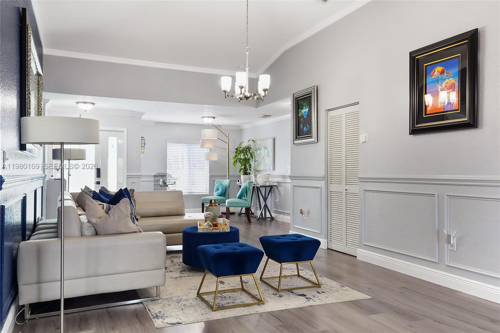 11397 Southwest 185th Terrace Miami, FL 33157 - Photo 5 of 15 a living room with furniture a desk and chair with wooden floor
