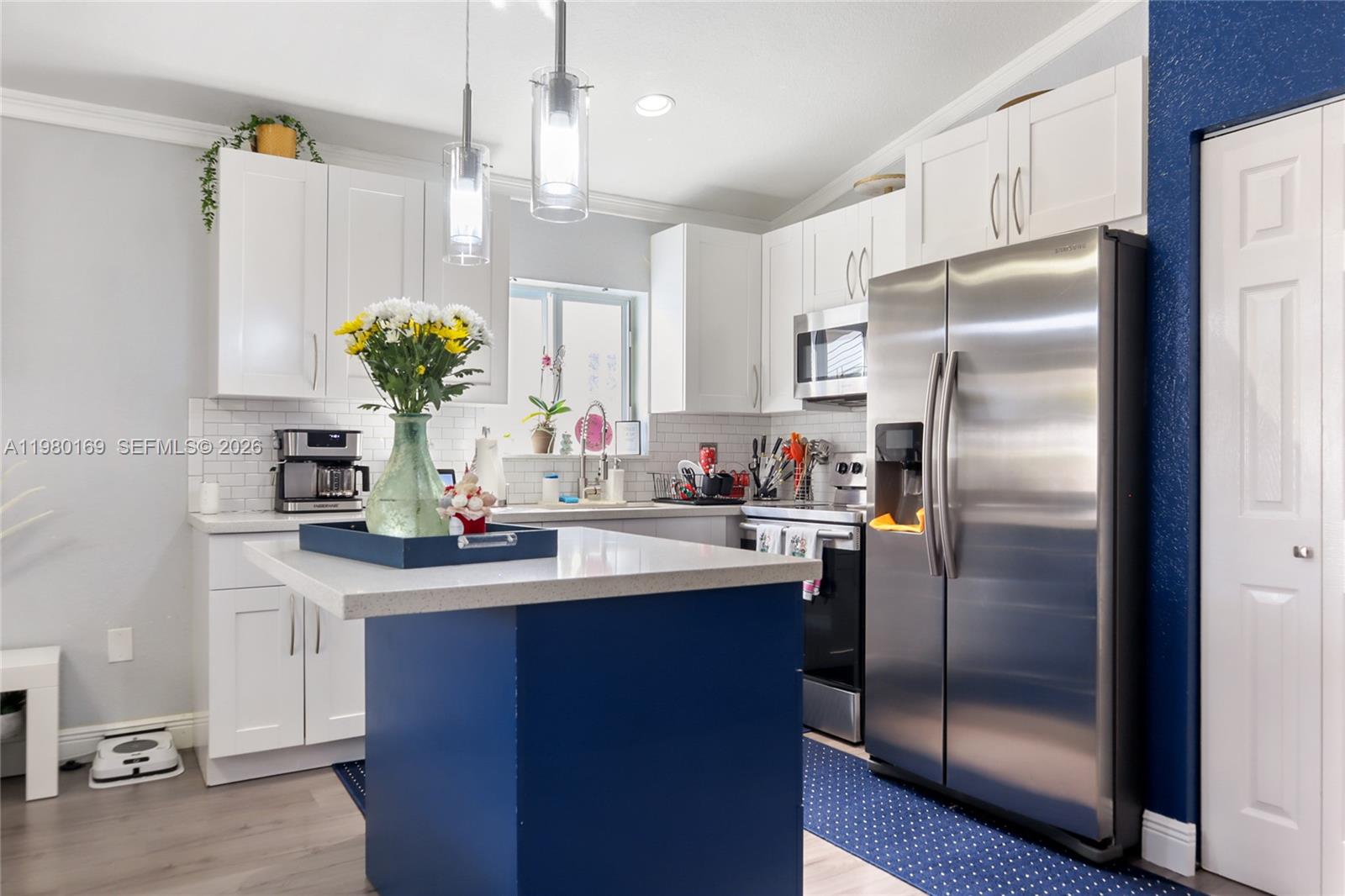 11397 Southwest 185th Terrace Miami, FL 33157 - Photo 6 of 15 a kitchen with refrigerator and cabinets