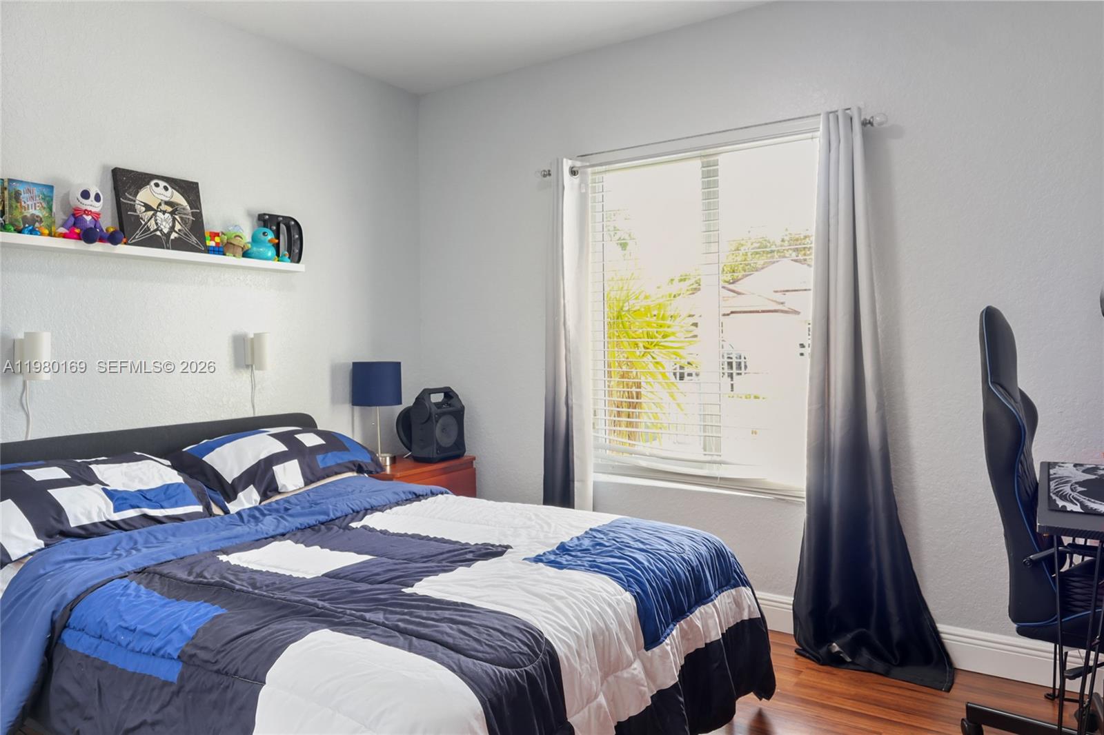 11397 Southwest 185th Terrace Miami, FL 33157 - Photo 9 of 15 a bedroom with a bed and a window