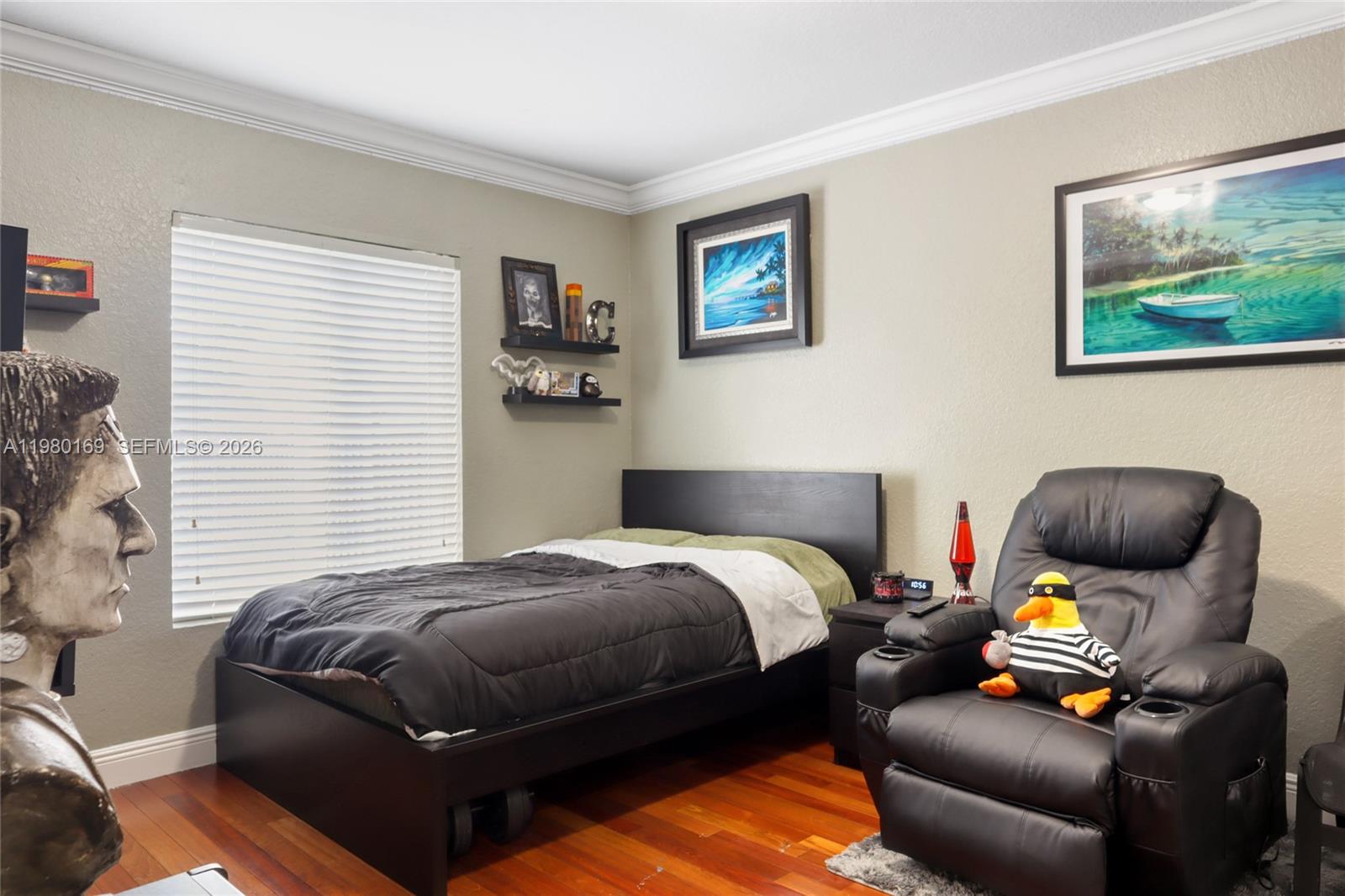 11397 Southwest 185th Terrace Miami, FL 33157 - Photo 10 of 15 a bedroom with a bed and wooden floor