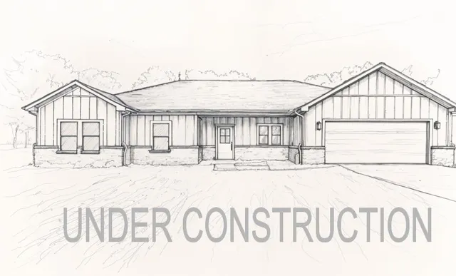 a kitchen with kitchen island granite countertop a sink and stainless steel appliances