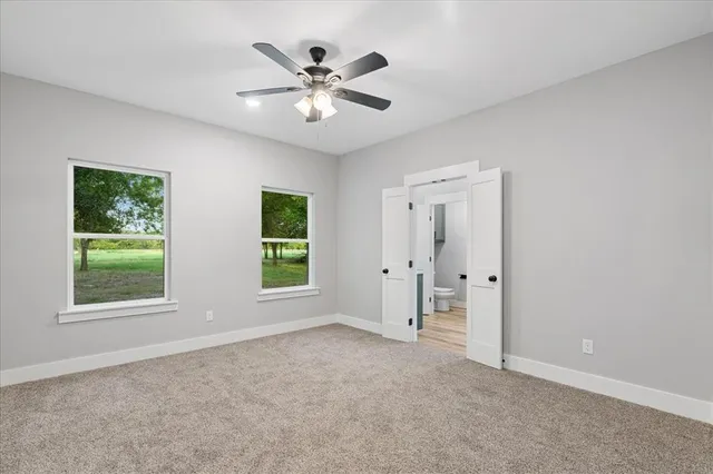 a bathroom with a toilet and a bathtub