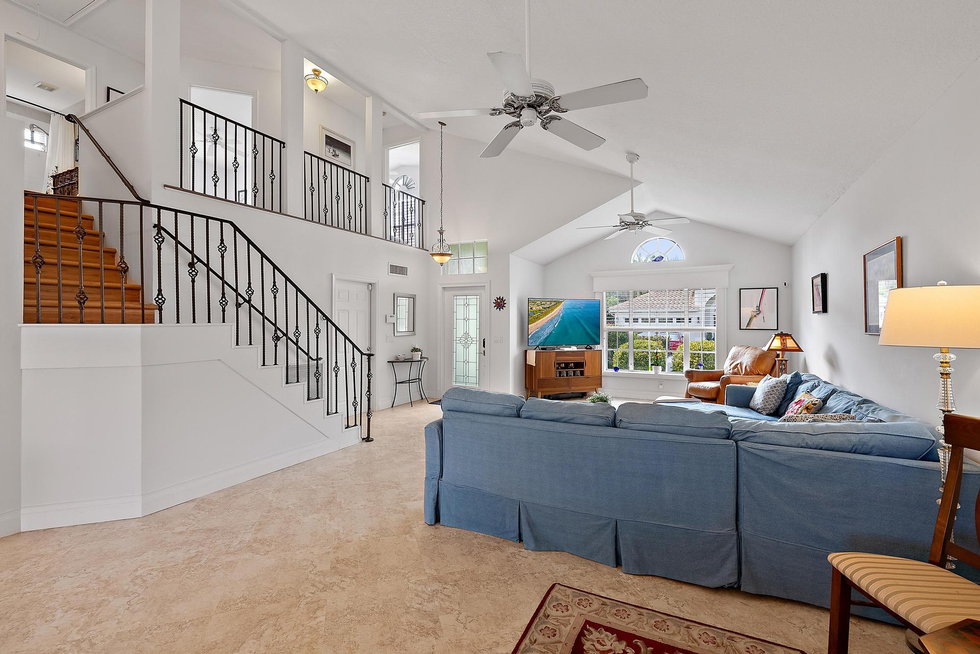 149 Stonebriar Boulevard Jupiter, FL 33458 - Photo 30 of 42 Living & Staircase