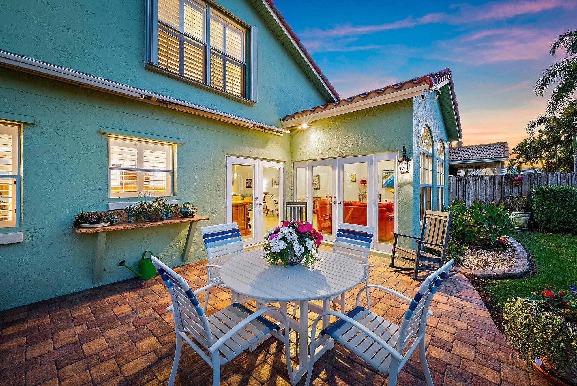 149 Stonebriar Boulevard Jupiter, FL 33458 - Photo 3 of 42 Patio & Back Exterior