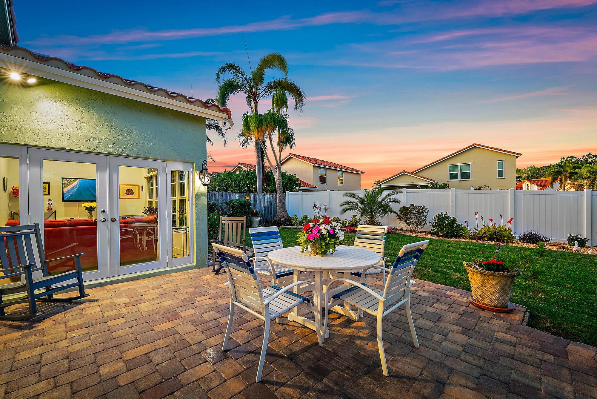 149 Stonebriar Boulevard Jupiter, FL 33458 - Photo 34 of 42 Patio & Back Exterior