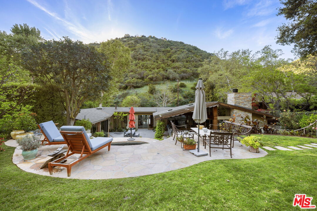 2618 Mandeville Canyon Road Los Angeles, CA 90049 - Photo 33 of 45 an outdoor space with furniture and garden