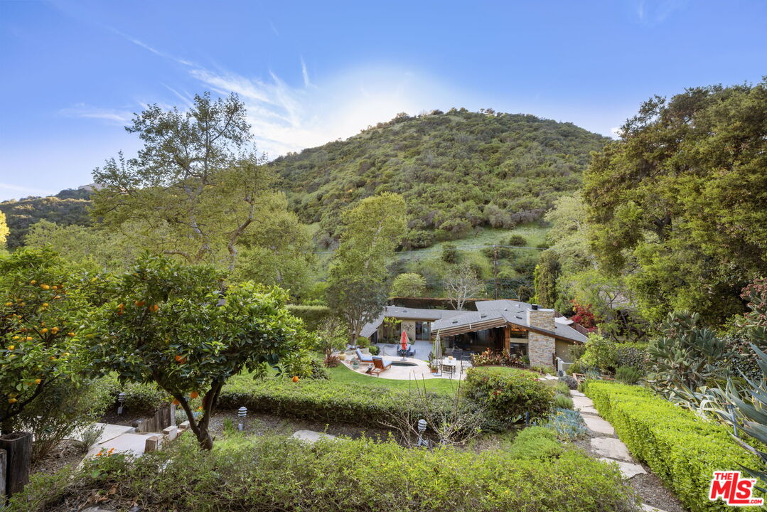 2618 Mandeville Canyon Road Los Angeles, CA 90049 - Photo 43 of 45 a aerial view of a house with a yard