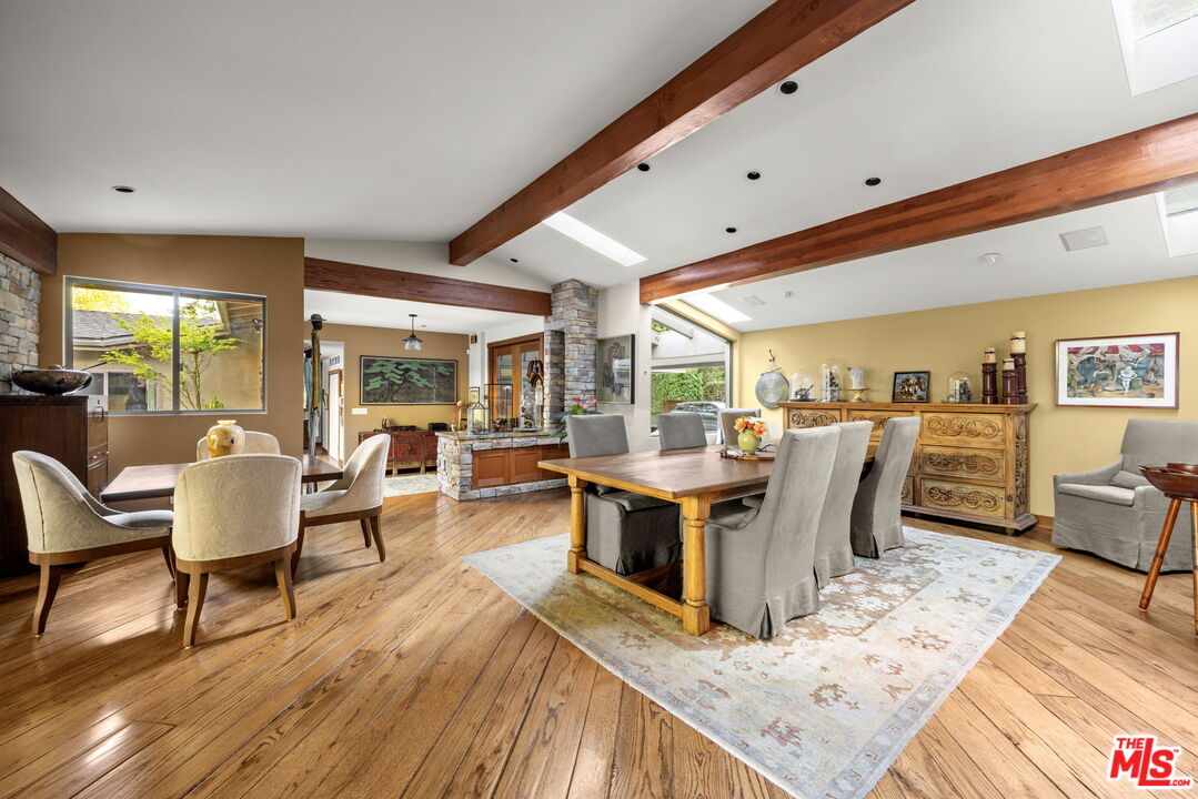 2618 Mandeville Canyon Road Los Angeles, CA 90049 - Photo 7 of 45 a view of a dining room with furniture
