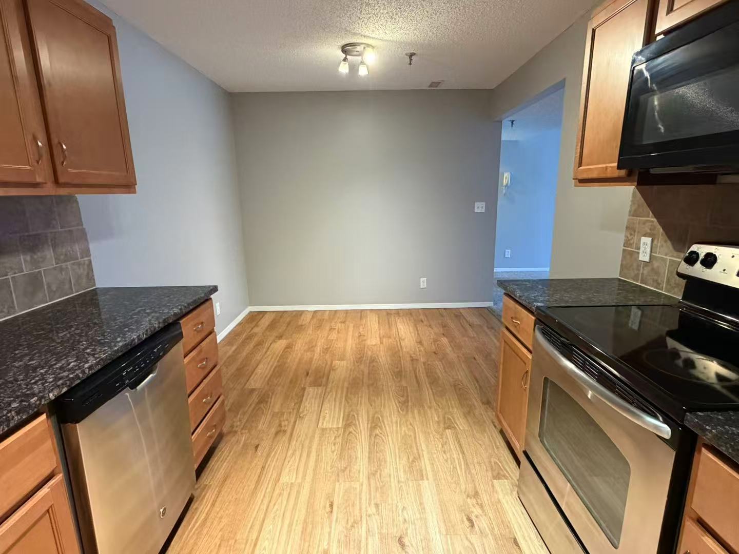 1360 Brook Street, Unit F St. Charles, IL 60174 - Photo 12 of 18 a kitchen with a wooden floor and a sink