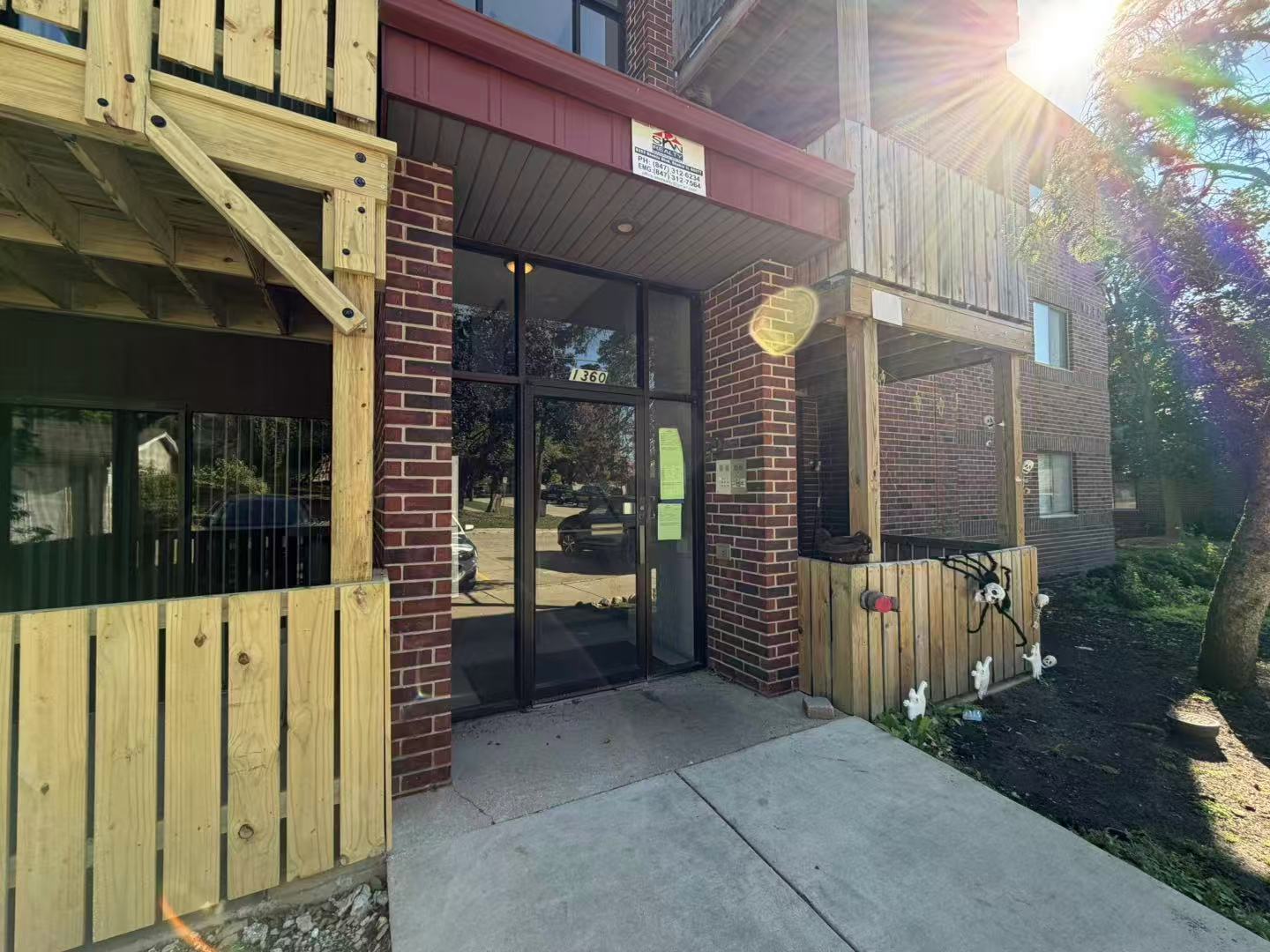 1360 Brook Street, Unit F St. Charles, IL 60174 - Photo 3 of 18 a view of a building with a porch