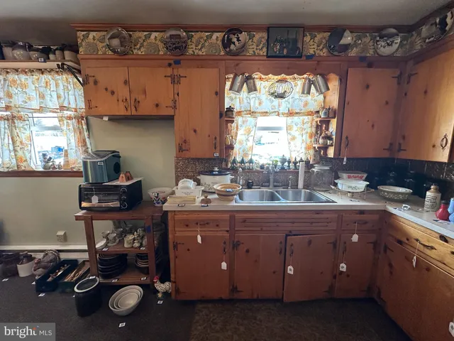 a living room with furniture and a book shelf