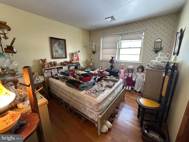 a bathroom with a toilet and a mirror