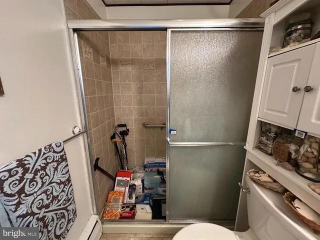 a bunch of bottles of wine sitting on a floor