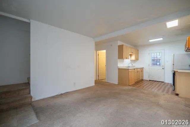 a view of a kitchen with a sink