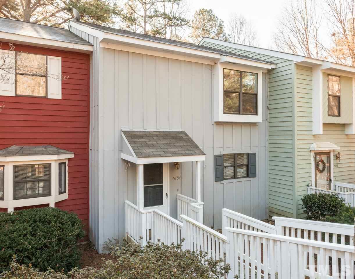 5754 Pool Side Drive Raleigh, NC 27612 - Photo 1 of 23 a front view of a house with a porch