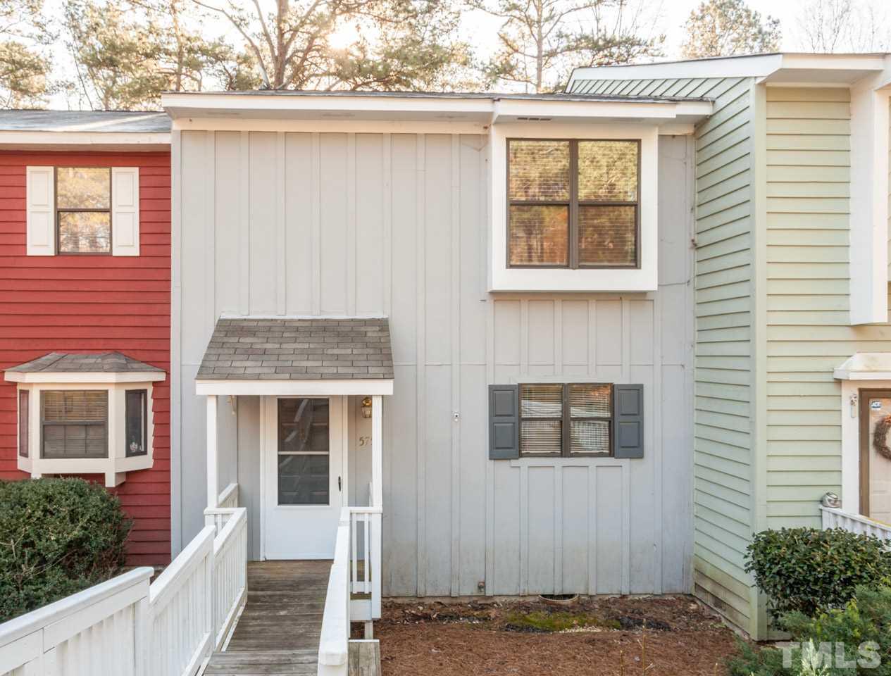 5754 Pool Side Drive Raleigh, NC 27612 - Photo 2 of 23 a front view of a house with a tree