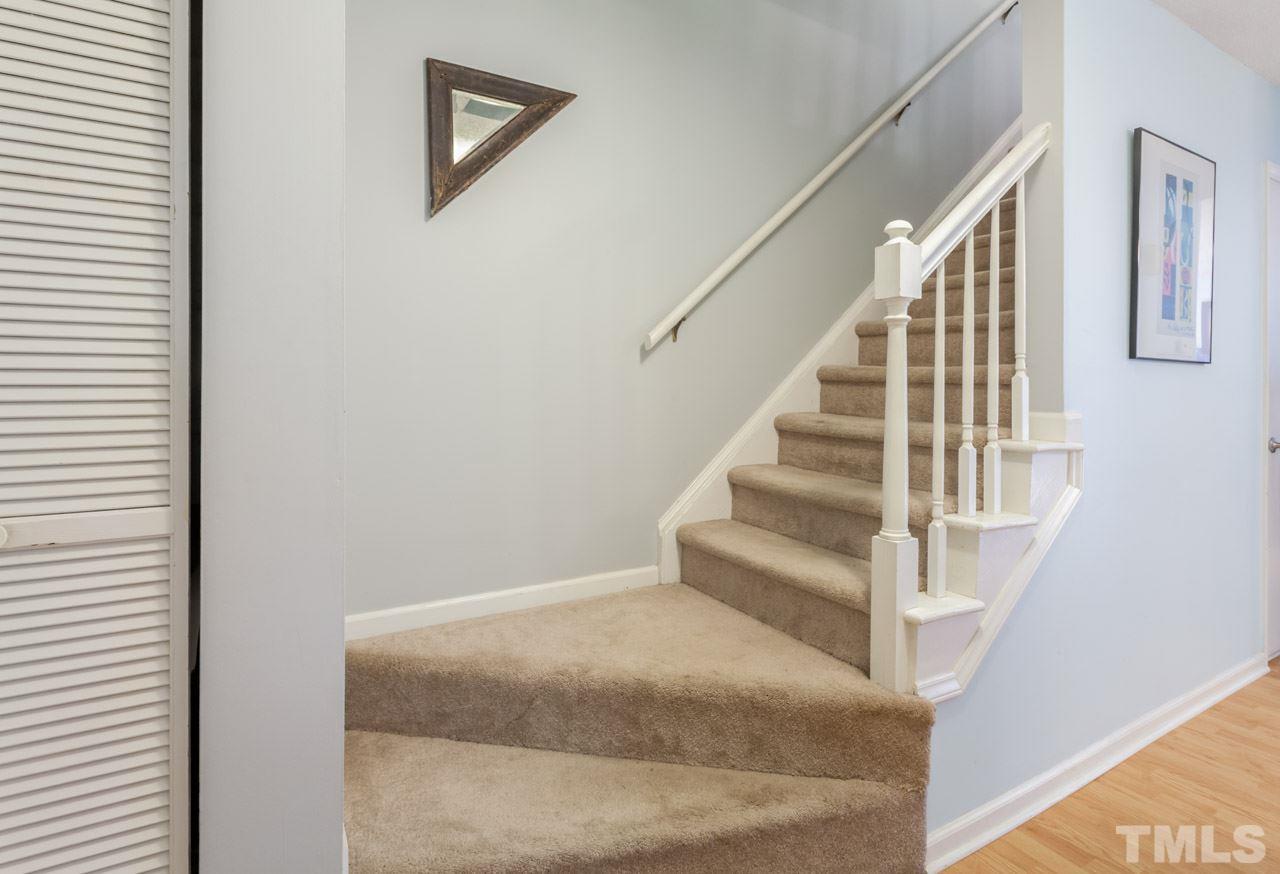 5754 Pool Side Drive Raleigh, NC 27612 - Photo 14 of 23 a view of staircase with white walls and white walls