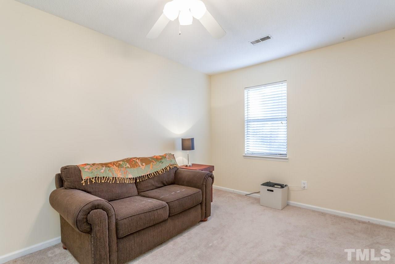 5754 Pool Side Drive Raleigh, NC 27612 - Photo 18 of 23 a living room with furniture and a window
