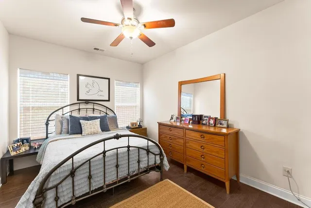 a bedroom with a bed and a dresser