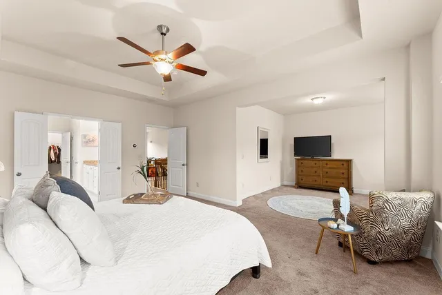 a bed room with a bed and a television