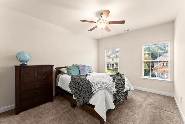 a bedroom with a bed and window