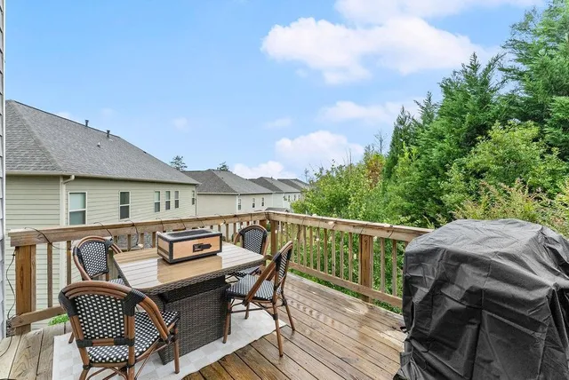 a view of a chairs and table on the deck