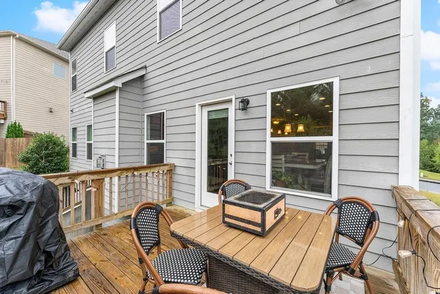 a view of a patio with a table and chairs