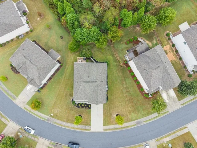 an aerial view of a house with swimming pool