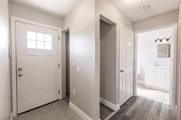 a view of a bathroom with a sink and a mirror