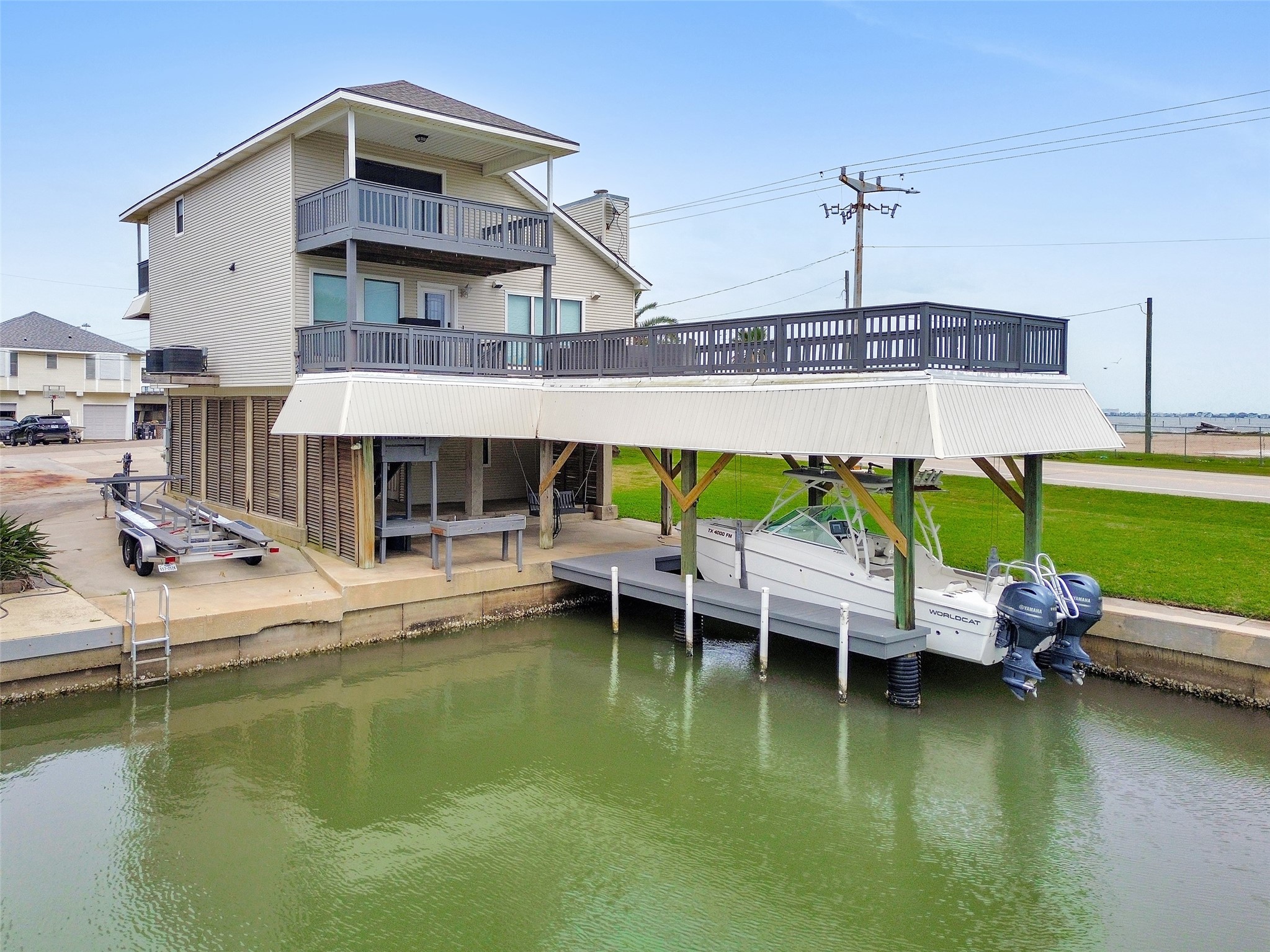 301 Commander Drive Tiki Island, TX 77554 - Photo 1 of 35 a view of a house with swimming pool