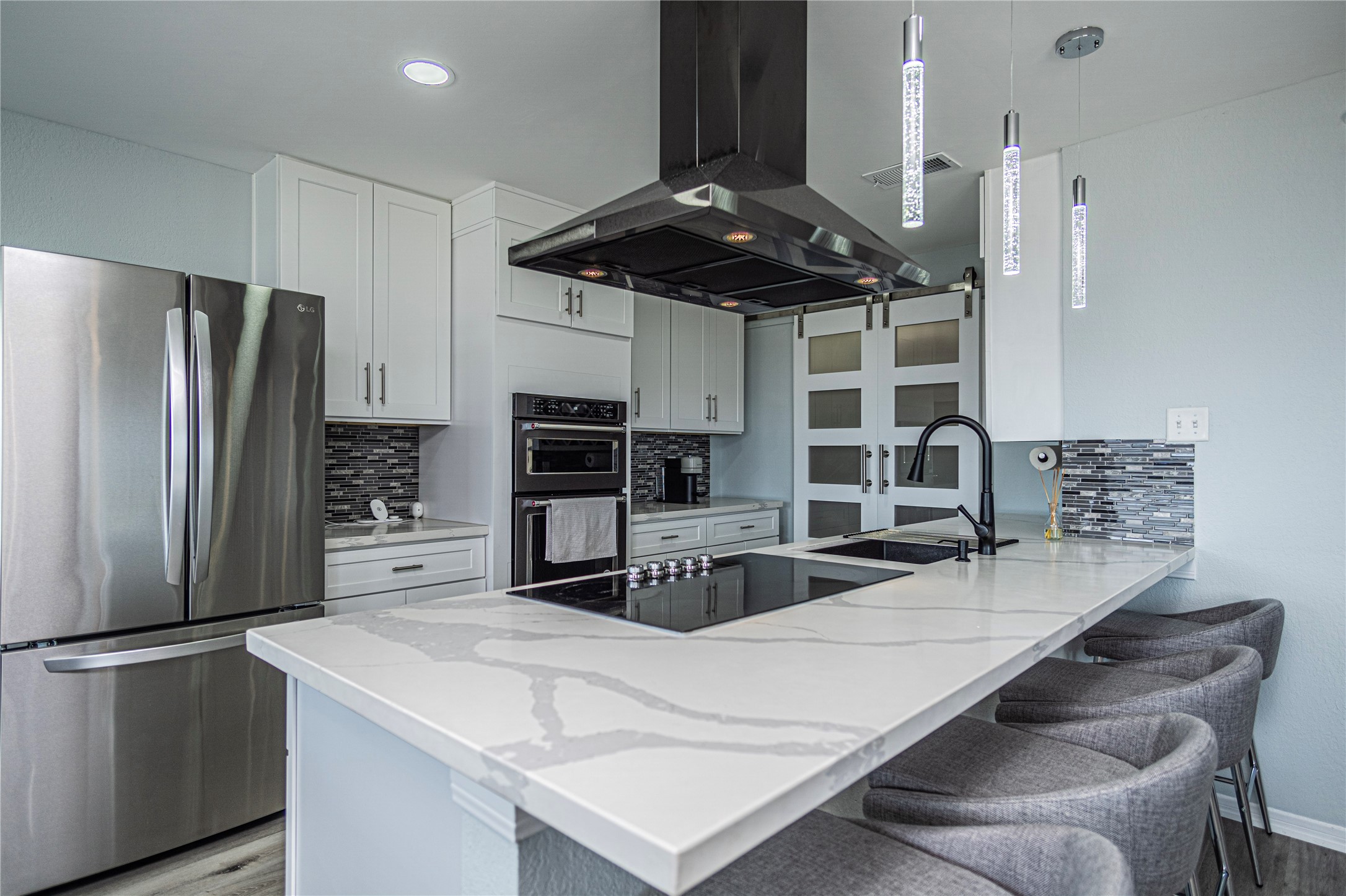 301 Commander Drive Tiki Island, TX 77554 - Photo 12 of 35 a kitchen with stainless steel appliances a refrigerator a stove and a sink